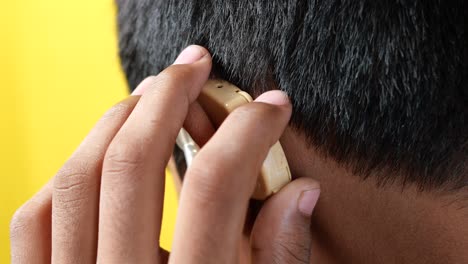 turning on the hearing aid machine