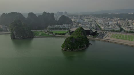 aerial view of ha long town, showcasing the coastal buildings on a gloomy day, with the cityscape stretching along the shore.
