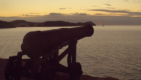 sunset time lapse of 19th century canon overlooking the entrance to st