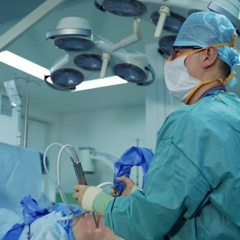surgery in modern hospital office. team of doctors performing surgical procedure in operating room