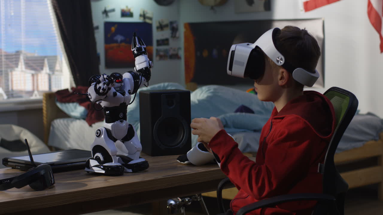 Boy with VR headset interacts with a robot toy