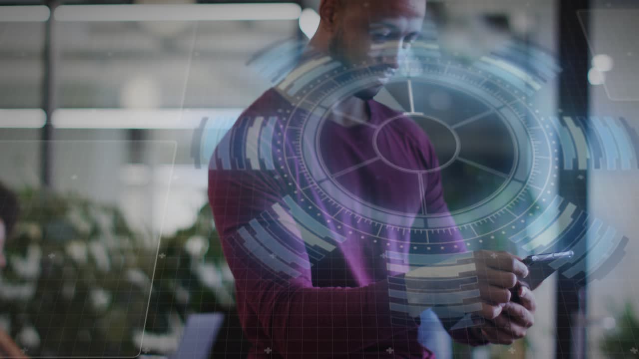 Man tapping handheld device in office, initiating holographic HUD and analyzing business charts