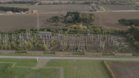 remenants of a decommissioned power station in the countryside, drone high angle