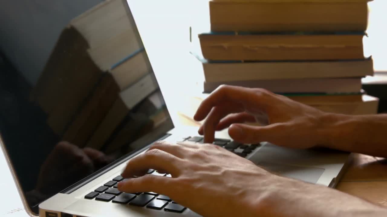 Student typing away on a laptop