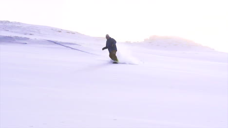 colorado cinematic winter wonderland super slow motion male man professional snowboarder snowboarding fresh snow powder top of vail pass colorado epic turns slash dreamy misty snow flakes