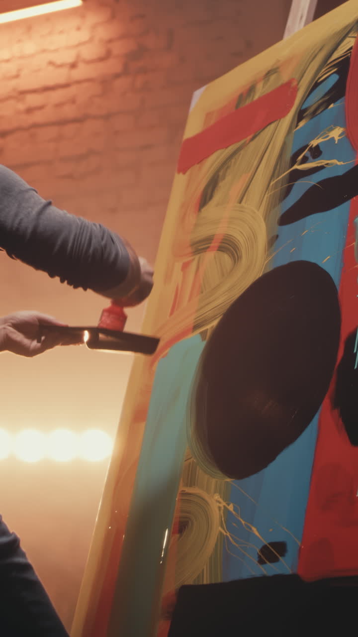 Artist Painting Abstract Artwork in Studio