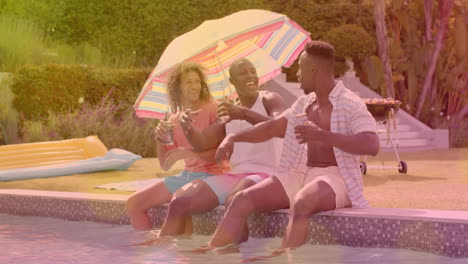 sitting by pool, friends enjoying drinks under colorful umbrella, summer fun