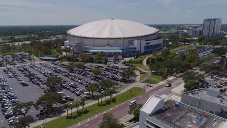 4k aerial drone video of tropicana field and full parking lot in downtown st