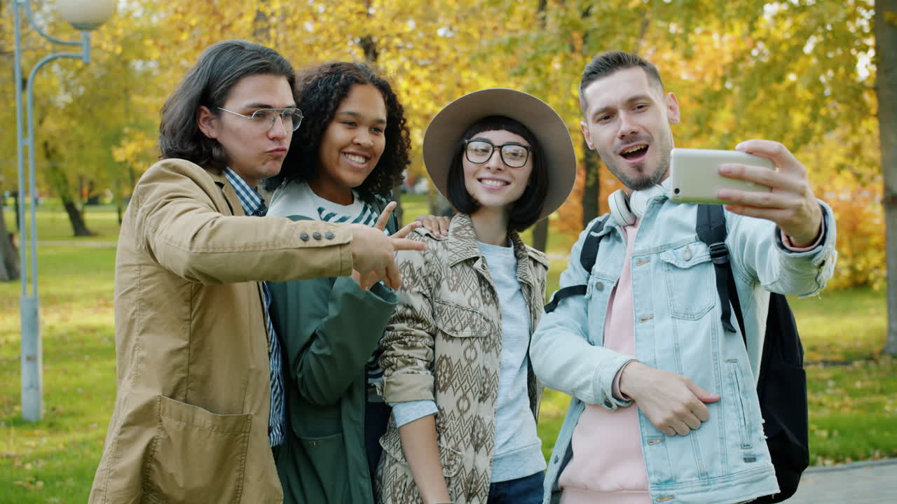 Friends Taking a Selfie in Autumn Park