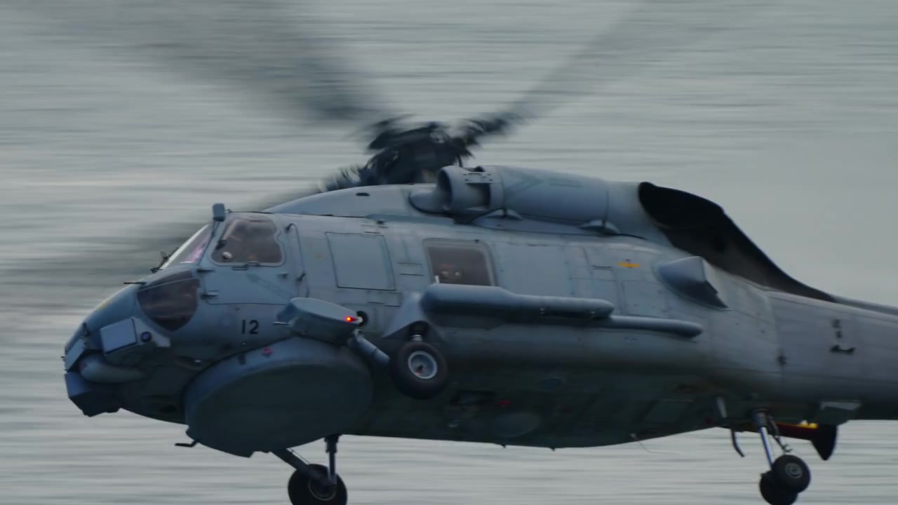 Spanish Navy SH-60 Seahawk number 12 in fast panning shot at Gijon