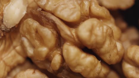 smooth camera movement over a handful walnuts.