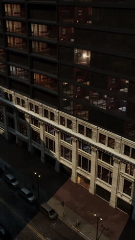 city street at night with buildings and people