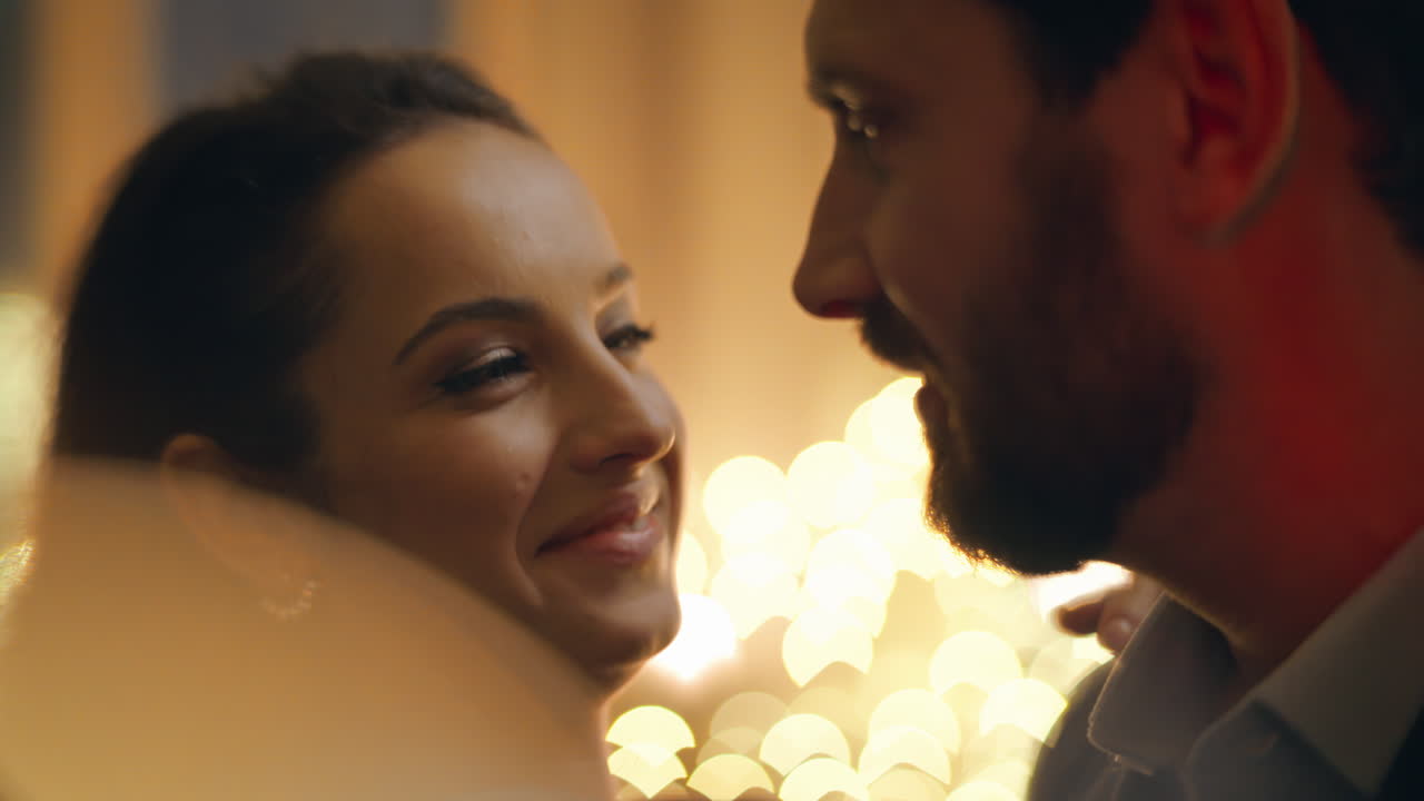 Loving couple dancing home spending romantic evening at candles light closeup