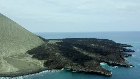 Steep-cliffs-slope-to-fan-shaped-rocky-tendrils-of-San-Benedicto-Revillagigedo-Islands-Mexico