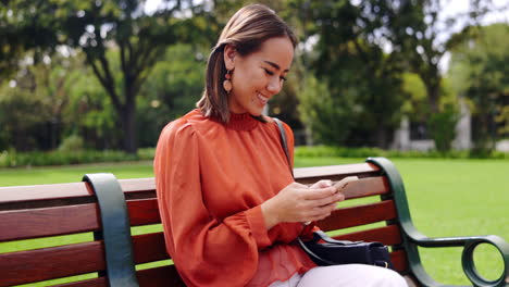 Relax,-phone-and-smile-with-woman-on-park-bench