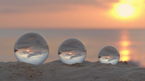 three crystal balls in beautiful sunset at karon beach