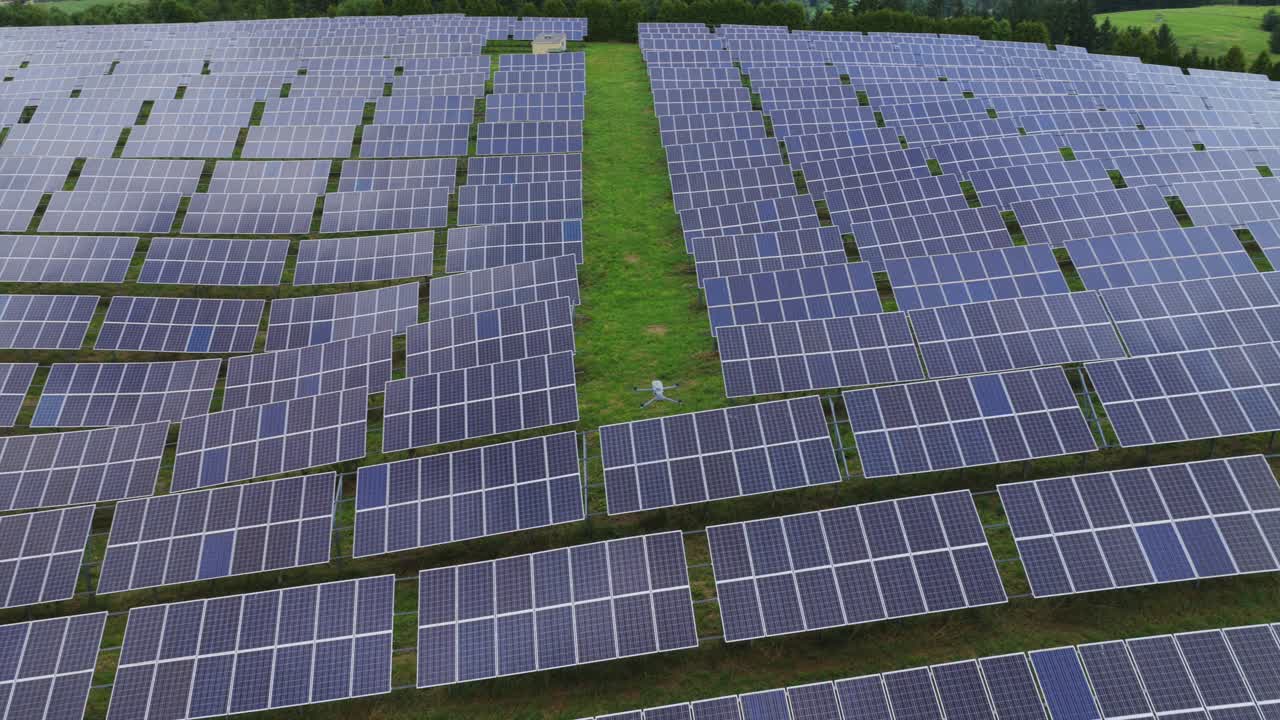 Solar farm, aerial of field with photovoltaic panels producing clean, renewable energy