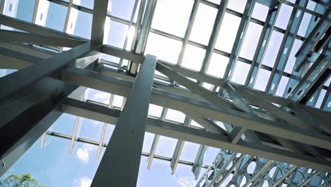 steel truss structure of house roof with bright sunlight at summer in the background