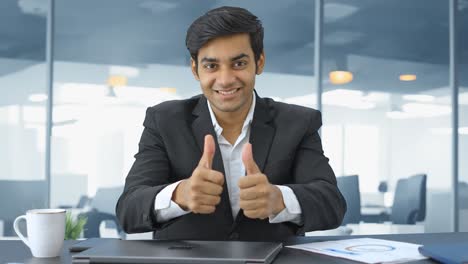 Happy-Indian-businessman-showing-thumbs-up-sign