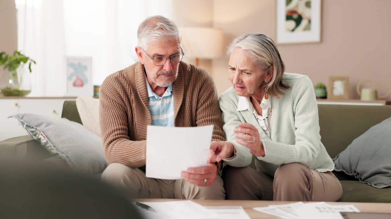 Senior couple reviewing financial documents
