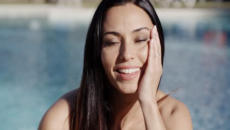 Vivacious-happy-young-woman-at-the-pool