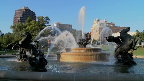 a downtown fountain in kansas city with buildings background 3