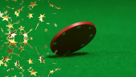 Composite-video-of-golden-star-icons-falling-against-close-up-of-poker-chip-on-green-surface