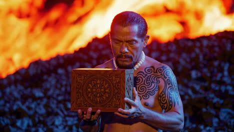 man holding wooden box in front of volcano