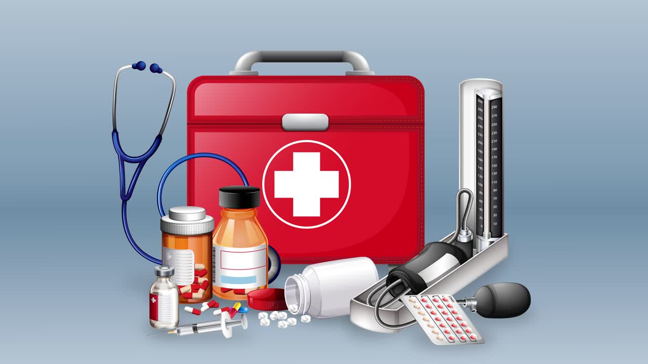 Various medical supplies arranged with a first aid kit