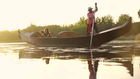 young girl in a boat floating on a lake. gondola with gondolier