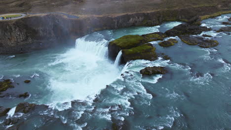 aerial view over glacial godafoss waterfall in iceland - drone shot