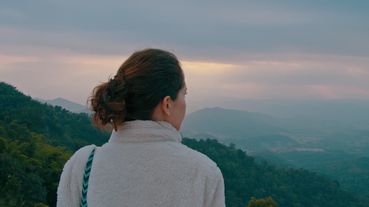 Woman Contemplating a Mountain View