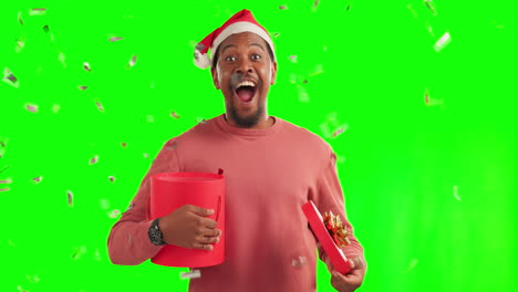Black-man,-Christmas-gift-and-confetti-on-green
