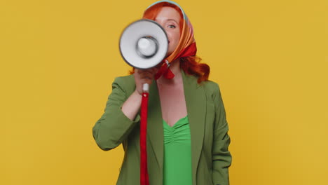 smiling ginger girl talking with megaphone, proclaiming news, loudly announcing sale advertisement