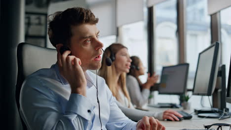 call operator listening client in office. friendly helpline team work together.