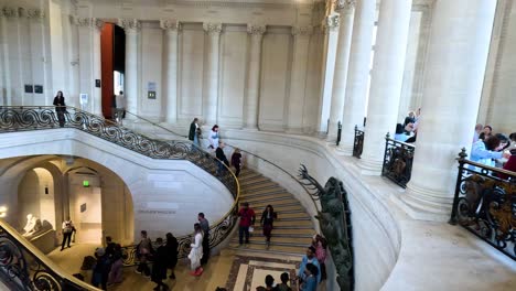 visitors ascending and descending grand staircase