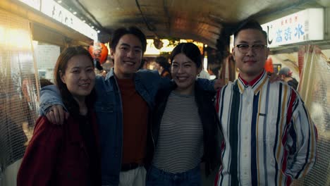four friends at a night market