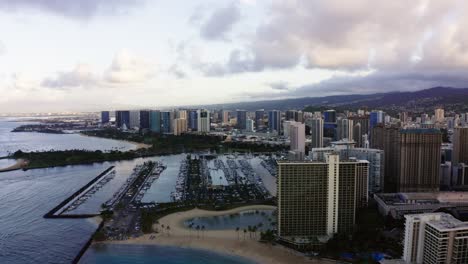 Drone-shot-of-Oahu's-Ala-Wai-Boat-Harbor-on-a-cloudy-evening