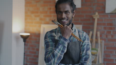 smiling artist in studio