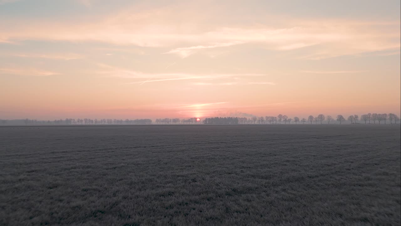 Sunrise over a Frozen Field