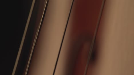 macro close up of cello, cello bow , cello playing and strings pulsing , music video , cello player