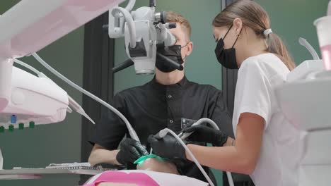 dentist examining a patient's teeth in the dentist.