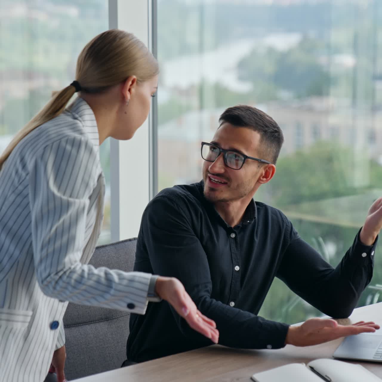 Colleagues having trouble in communication solving problems at work. Male and female co-workers misunderstanding each other discussing work