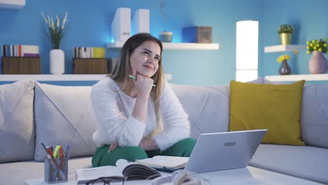 Young-woman-thinking-about-happy-moments-and-smiling.