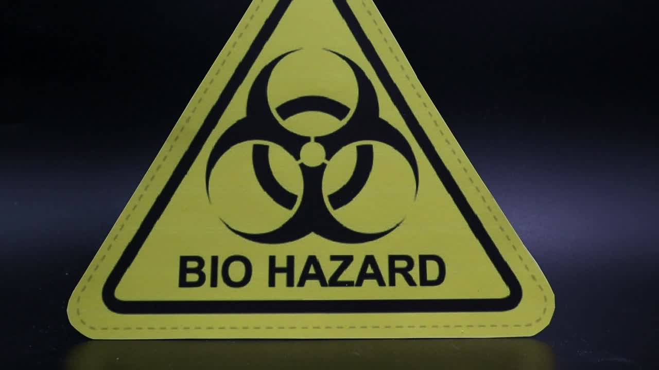 Zooming towards a Biohazard sign, isolated on black background