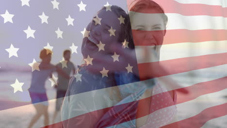 Animation-of-flag-of-usa-over-happy-diverse-women-on-beach-in-summer