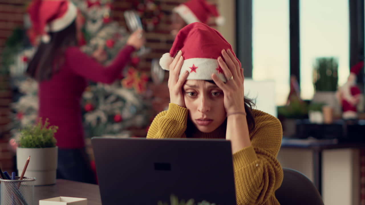 Frustrated tired woman trying to work in noisy office