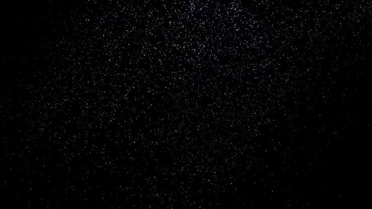 Dust floating in the air on black background 05