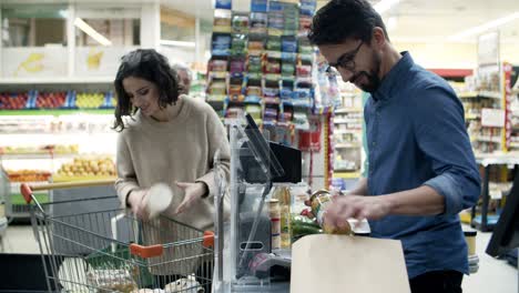 woman buying products in supermarket