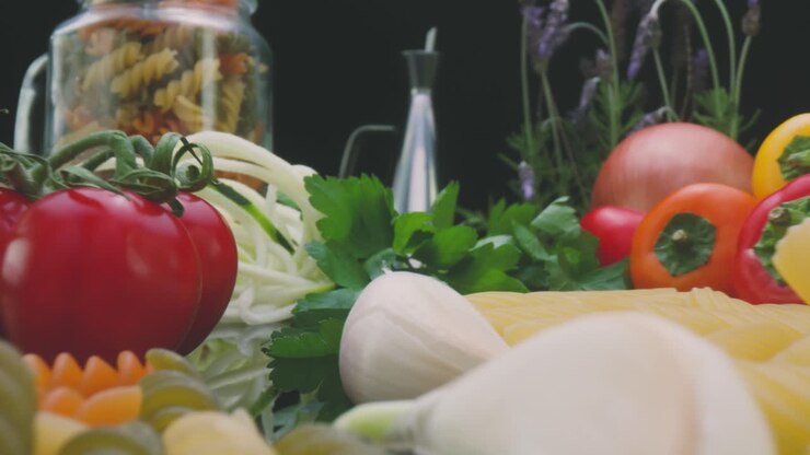 Uncooked dried pasta and fresh vegetables